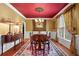 Formal dining room with hardwood floors, elegant lighting, and ample seating for six at 1903 Brackendale Nw Rd, Kennesaw, GA 30152