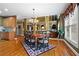 Spacious dining room with hardwood floors, chandelier, and adjacent view of the living room at 1903 Brackendale Nw Rd, Kennesaw, GA 30152