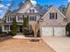 Beautiful two-story brick home with a well-manicured front yard and attached two-car garage at 1903 Brackendale Nw Rd, Kennesaw, GA 30152