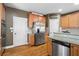 Close-up of the stainless steel refrigerator in a kitchen with granite countertops and light wood cabinets at 1903 Brackendale Nw Rd, Kennesaw, GA 30152