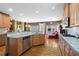 Open kitchen with granite countertops, stainless steel appliances, and a view to an adjacent seating area at 1903 Brackendale Nw Rd, Kennesaw, GA 30152