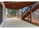 Covered patio with stairs leading to yard at 1903 Brackendale Nw Rd, Kennesaw, GA 30152