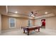 Finished basement features a pool table under a ceiling fan with recessed lighting at 1903 Brackendale Nw Rd, Kennesaw, GA 30152