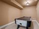 Basement rec room with air hockey table at 1903 Brackendale Nw Rd, Kennesaw, GA 30152