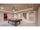 Spacious rec room with a pool table, columns, and access to other rooms at 1903 Brackendale Nw Rd, Kennesaw, GA 30152