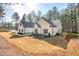 The rear exterior view shows the home's well-maintained backyard and a partial view of the home's structure at 1312 Mcgarity Rd, Temple, GA 30179