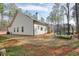 Exterior view of the home's backyard with trampoline and wooded surroundings at 1312 Mcgarity Rd, Temple, GA 30179