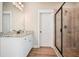 Charming bathroom features a glass shower, granite counters, and bright lighting for an ideal spa experience at 1312 Mcgarity Rd, Temple, GA 30179