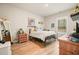 A cozy bedroom with neutral walls, wood-look floors, and natural light creates a calming retreat at 1312 Mcgarity Rd, Temple, GA 30179