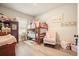Delightful bedroom with bunk beds, plush decor, and wood-look floors is cheerful and inviting at 1312 Mcgarity Rd, Temple, GA 30179