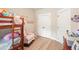 A cozy bedroom with bunk beds, a rocking chair, and stylish decor is perfect for sleep and play at 1312 Mcgarity Rd, Temple, GA 30179
