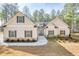 Charming single-Gathering home featuring stone accents and a welcoming front porch with a lovely front yard at 1312 Mcgarity Rd, Temple, GA 30179