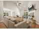 Comfortable living room with hardwood floors and vaulted ceilings provides a fireplace and cozy seating at 1312 Mcgarity Rd, Temple, GA 30179