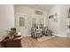 Cozy living room nook featuring natural light and a view to an outdoor garden at 1312 Mcgarity Rd, Temple, GA 30179