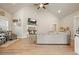Bright living room boasts a vaulted ceiling, stone fireplace, and comfortable sofa at 1312 Mcgarity Rd, Temple, GA 30179
