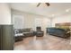 Large main bedroom features wood floors, sitting area, sofa, and bed with decorative throw at 1312 Mcgarity Rd, Temple, GA 30179