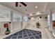 Open basement layout featuring decorative columns, an exercise area, and neutral paint at 4580 Lakefield Bend Bnd, Berkeley Lake, GA 30096