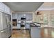 Well-lit kitchen with stainless steel appliances, including a range and oven, plus gray cabinets at 4580 Lakefield Bend Bnd, Berkeley Lake, GA 30096