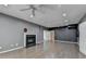 Spacious living room with fireplace, ceiling fan, neutral color palette and recessed lighting at 4580 Lakefield Bend Bnd, Berkeley Lake, GA 30096