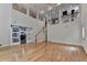 Spacious living room with hardwood floors, sliding barn doors, and natural light at 4580 Lakefield Bend Bnd, Berkeley Lake, GA 30096