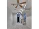 Bonus living space with ceiling fans, neutral carpet, and staircase at 4580 Lakefield Bend Bnd, Berkeley Lake, GA 30096