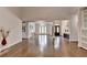 Spacious living room features hardwood floors, white walls, and large windows for ample natural light at 4580 Lakefield Bend Bnd, Berkeley Lake, GA 30096