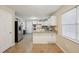 Bright kitchen with white cabinets, stainless steel appliances, and granite countertops at 7463 Lerose Dr, Jonesboro, GA 30236