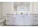 Modern bathroom with double vanity, illuminated mirror, and sleek, minimalist design at 788 W Marietta Nw St # 1302, Atlanta, GA 30318