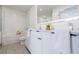 Modern bathroom with a double vanity, bathtub, and a well-lit mirror at 788 W Marietta Nw St # 1302, Atlanta, GA 30318