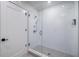 Bright bathroom features a walk-in shower with white subway tile and glass door at 788 W Marietta Nw St # 1302, Atlanta, GA 30318