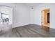Large bedroom with hardwood floors and access to the living room and closet at 788 W Marietta Nw St # 1302, Atlanta, GA 30318