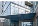 Exterior of the building, featuring a glass facade, modern architecture, and elegant signage at 788 W Marietta Nw St # 1302, Atlanta, GA 30318