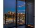 Balcony view of city skyline at dusk through large glass windows at 788 W Marietta Nw St # 1302, Atlanta, GA 30318