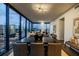 Bright and airy dining room with modern lighting and views of the city skyline through large windows at 788 W Marietta Nw St # 1302, Atlanta, GA 30318