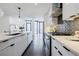 Open-concept kitchen featuring quartz countertops, stainless steel appliances, and modern design at 788 W Marietta Nw St # 1302, Atlanta, GA 30318