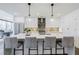 Bright kitchen featuring a large center island with seating and modern pendant lighting at 788 W Marietta Nw St # 1302, Atlanta, GA 30318