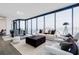 Open-concept living and dining area featuring floor-to-ceiling windows with city views at 788 W Marietta Nw St # 1302, Atlanta, GA 30318