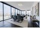 Open-concept living area with modern dining table, floor-to-ceiling windows, and skyline views at 788 W Marietta Nw St # 1302, Atlanta, GA 30318