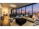 Spacious living area boasts modern furnishings, an open floor plan, and city skyline views at 788 W Marietta Nw St # 1302, Atlanta, GA 30318