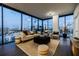 Modern living room featuring floor-to-ceiling windows and a comfortable seating arrangement with city views at 788 W Marietta Nw St # 1302, Atlanta, GA 30318