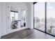 Bright living room with hardwood floors, floor to ceiling windows and city views at 788 W Marietta Nw St # 1302, Atlanta, GA 30318