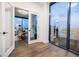 Stylish living room featuring hardwood floors, floor to ceiling windows, and city views at 788 W Marietta Nw St # 1302, Atlanta, GA 30318