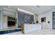 Lobby with tiled floor and a reception desk with marble countertop and orchids at 788 W Marietta Nw St # 1302, Atlanta, GA 30318