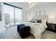 Bright main bedroom with a large window, modern decor, and comfortable furnishings at 788 W Marietta Nw St # 1302, Atlanta, GA 30318