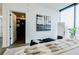 Stylish main bedroom with a walk-in closet, modern decor, and a large window at 788 W Marietta Nw St # 1302, Atlanta, GA 30318