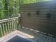 The outdoor deck features a privacy screen adorned with hanging plants, creating a tranquil and inviting space at 1540 Cedar Bluff Trl, Marietta, GA 30062