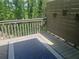 A cozy outdoor deck space offers a relaxing retreat with its stylish rug and privacy screen at 1540 Cedar Bluff Trl, Marietta, GA 30062