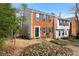 Charming two-story townhouse featuring brick and siding exterior with shuttered windows at 1540 Cedar Bluff Trl, Marietta, GA 30062