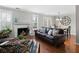Open-concept living room and dining area with fireplace and hardwood floors at 1540 Cedar Bluff Trl, Marietta, GA 30062