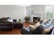 Spacious living room with cozy fireplace and hardwood floors at 1540 Cedar Bluff Trl, Marietta, GA 30062